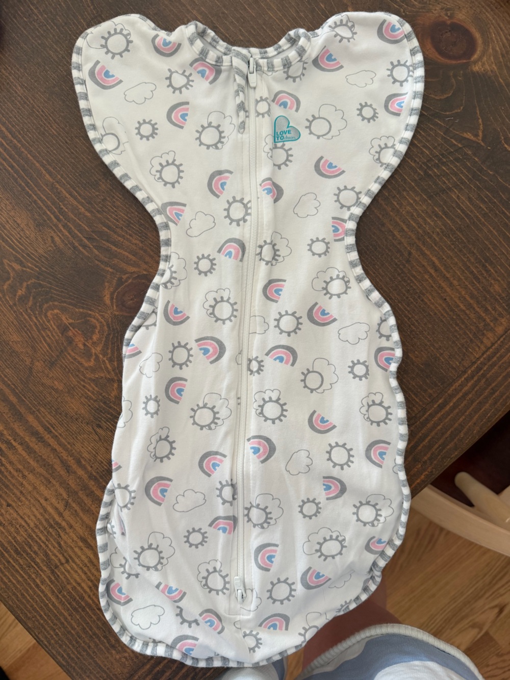 Love to Dream Baby Swaddle in White with Pink and Gray Rainbows
